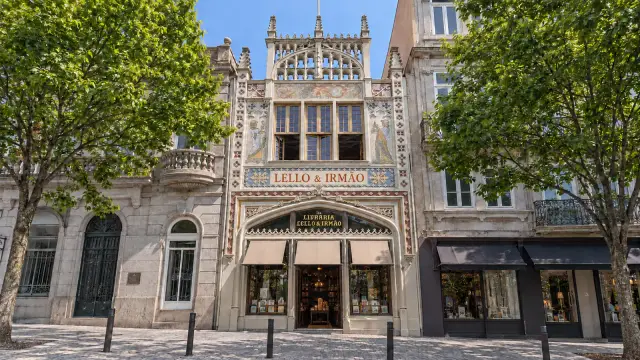 The neo-Gothic façade of Livraria Lello in Porto, with pinnacles and a broad arch over the entrance