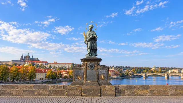 Statue of St John of Nepomuk with its halo of five stars on the Charles Bridge in Prague